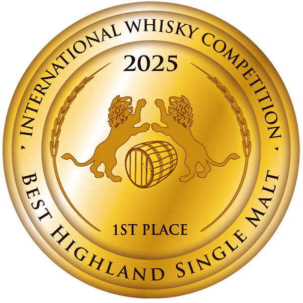 Gold medal with two lions, barrel and wheat stalks, inscribed “International Whisky Competition 1st Place 2025.”